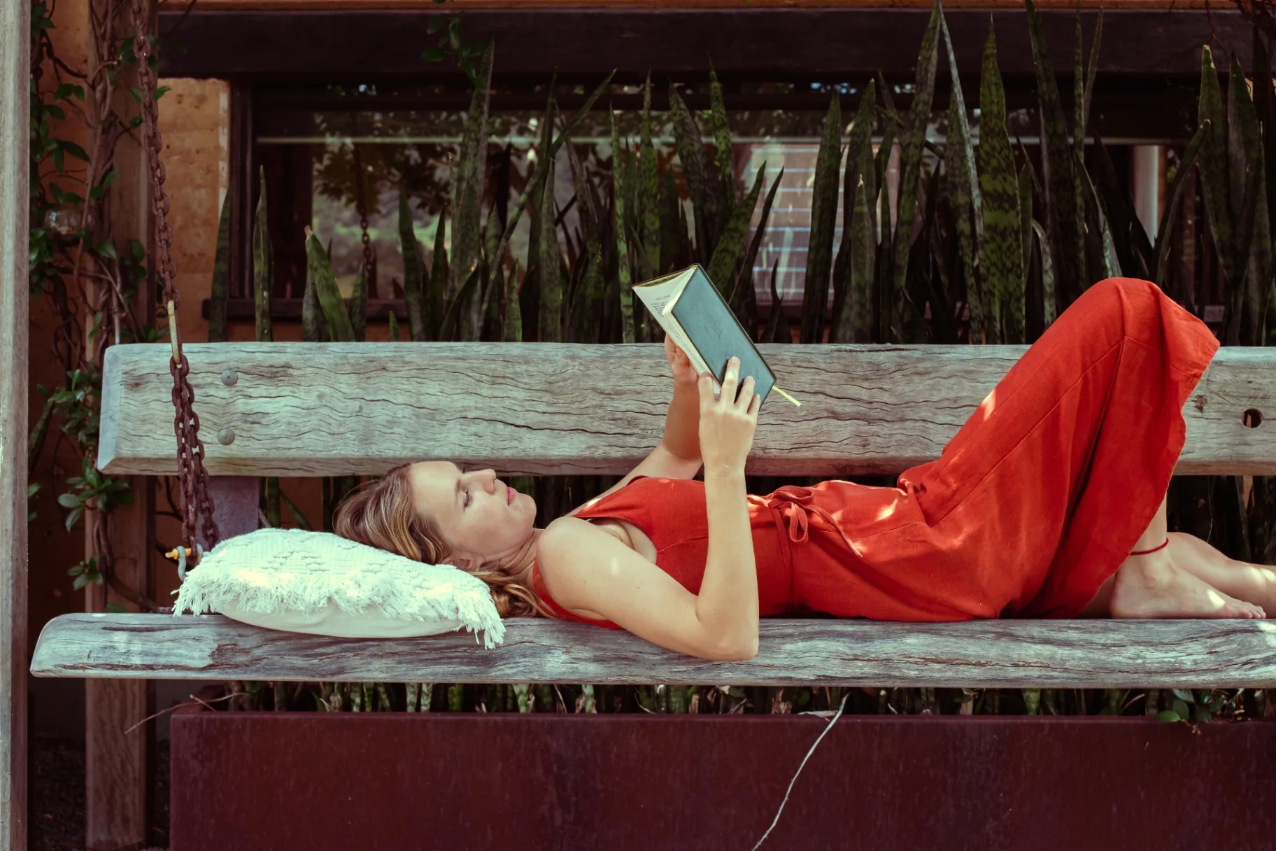 Reading on the garden swing