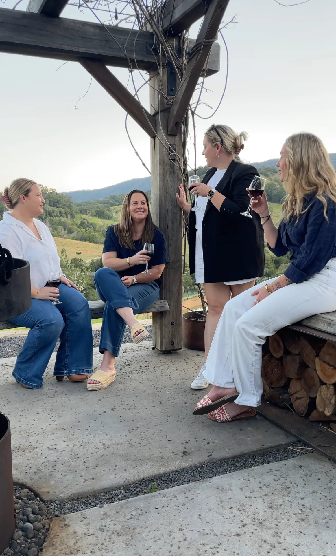 A group sharing wine under the arbour